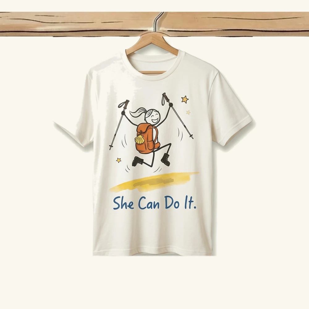 She Can Do It tee — the heroine jumping with trekking poles